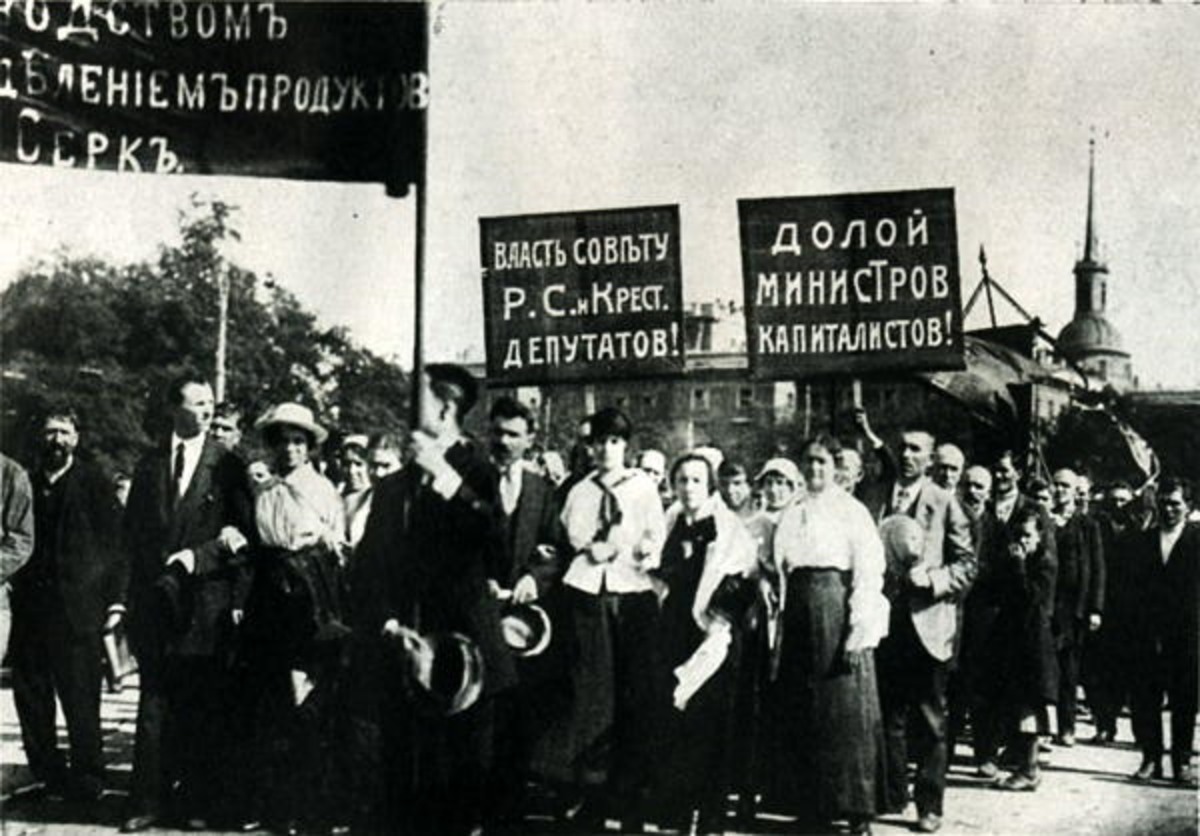 Demonstrators on the Field of Mars in Petrograd carrying placards reading “All power to the Soviets” and “Down with the capitalist ministers”, 1917